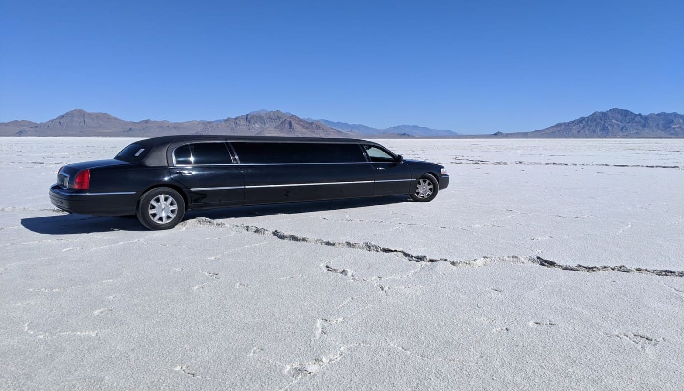 Sleek black limousine parked outdoors